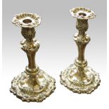 A pair of CK and JF silver plated candlesticks.