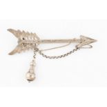 A Victorian arrow brooch, featuring engraved scroll design, stamped reverse 'Regd 30 March 1848',