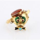 A novelty duck ring, set with ruby eyes and turquoise bow tie, with enamel detailing, stamped