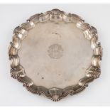 A Goldsmiths & Silversmiths Co. silver salver, of circular form with pie crust edge, centrally