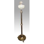 A bronze finished floor standing oil lamp with glass bowl.