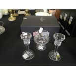 *A pair of Waterford crystal candlestick holders, together with a Waterford crystal glass and a pair