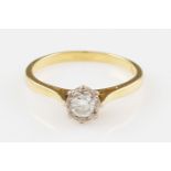 An 18ct yellow gold diamond solitaire ring, illusion set with a round brilliant cut diamond, approx.
