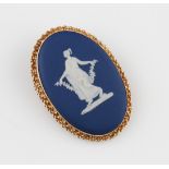 A 9ct yellow gold framed Wedgwood cameo brooch, the classical lady figure on blue background, with