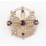 An amethyst and seed pearl brooch, of circular floral design set with seed pearls and five round cut