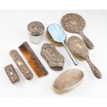 A collection of silver dressing table items, to include an enamel hair brush, hallmarked