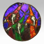 A lead stained glass, round panel depicting three witches.