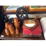 A miniature spinning wheel with storage boxes and a footstool.