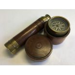 A mahogany and brass three drawer telescope with an R. Alexander compass in fruitwood pot.