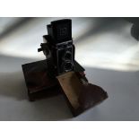 A Zeus Ikon Ikoflex box camera in brown leather case with filter lens.