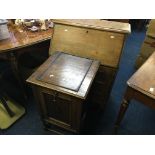 An oak pull down front cupboard, oak bureau, two signer sewing machines, cutlery box etc.