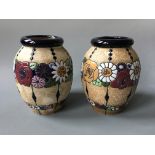 A pair of Austrian vases model 16071 with glazed floral design. Height 24cm.