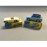 A Corgi 300 Austin Healey sports car and 216 Austin A.40 Saloon, in boxes. (NO CONDITION REPORT,