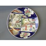 A Japanese painted charger with monogram to base. Diameter 40cm.