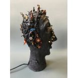 SUE MACPHERSON. Titled 'Things in my head', lamp in form of mixed media sculpture bust with toy