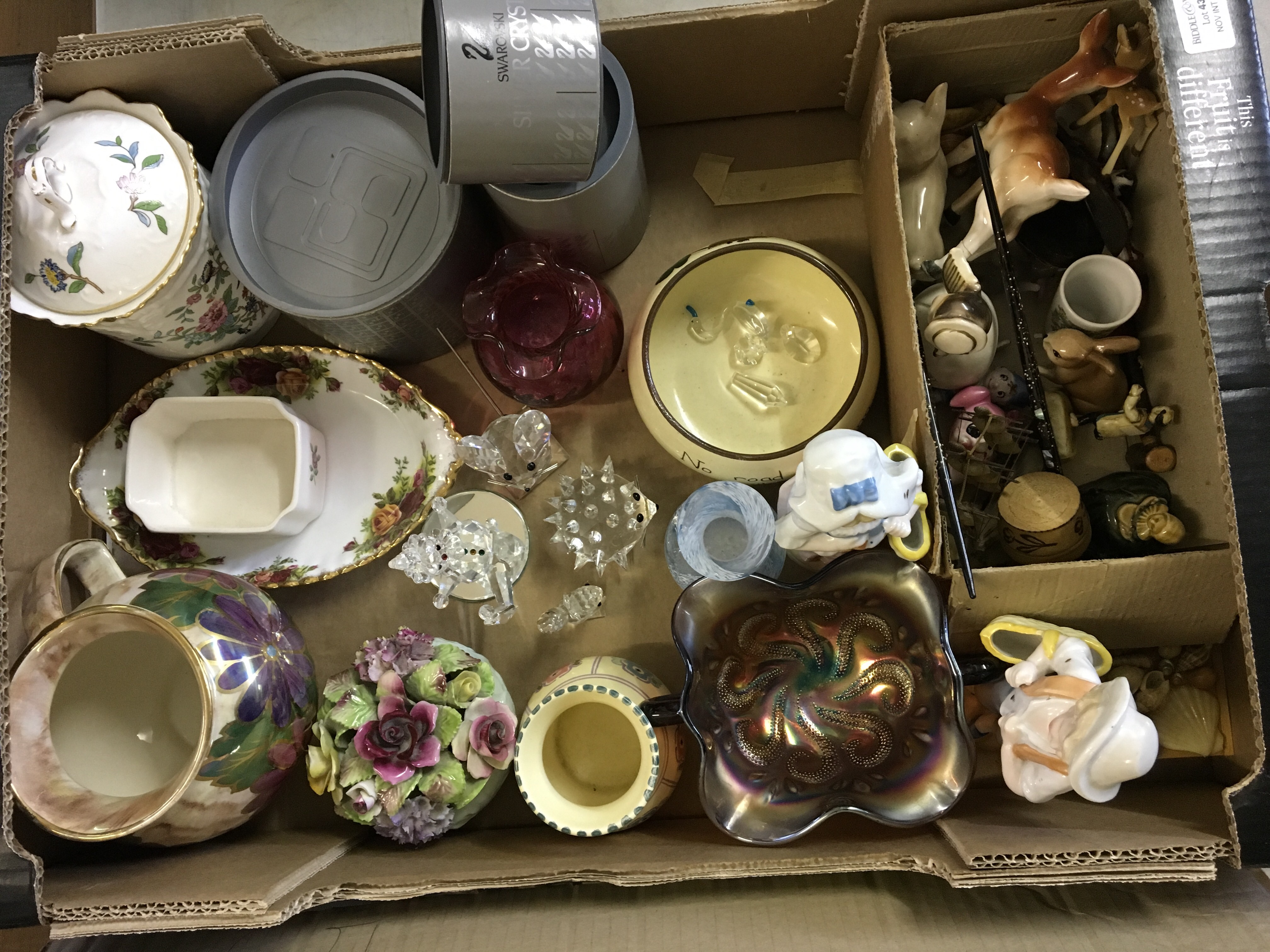 A carton of seven Swarovski crystal figures, carnival dish, pair of China figures and various
