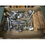 A selection of various cutlery with boxes.