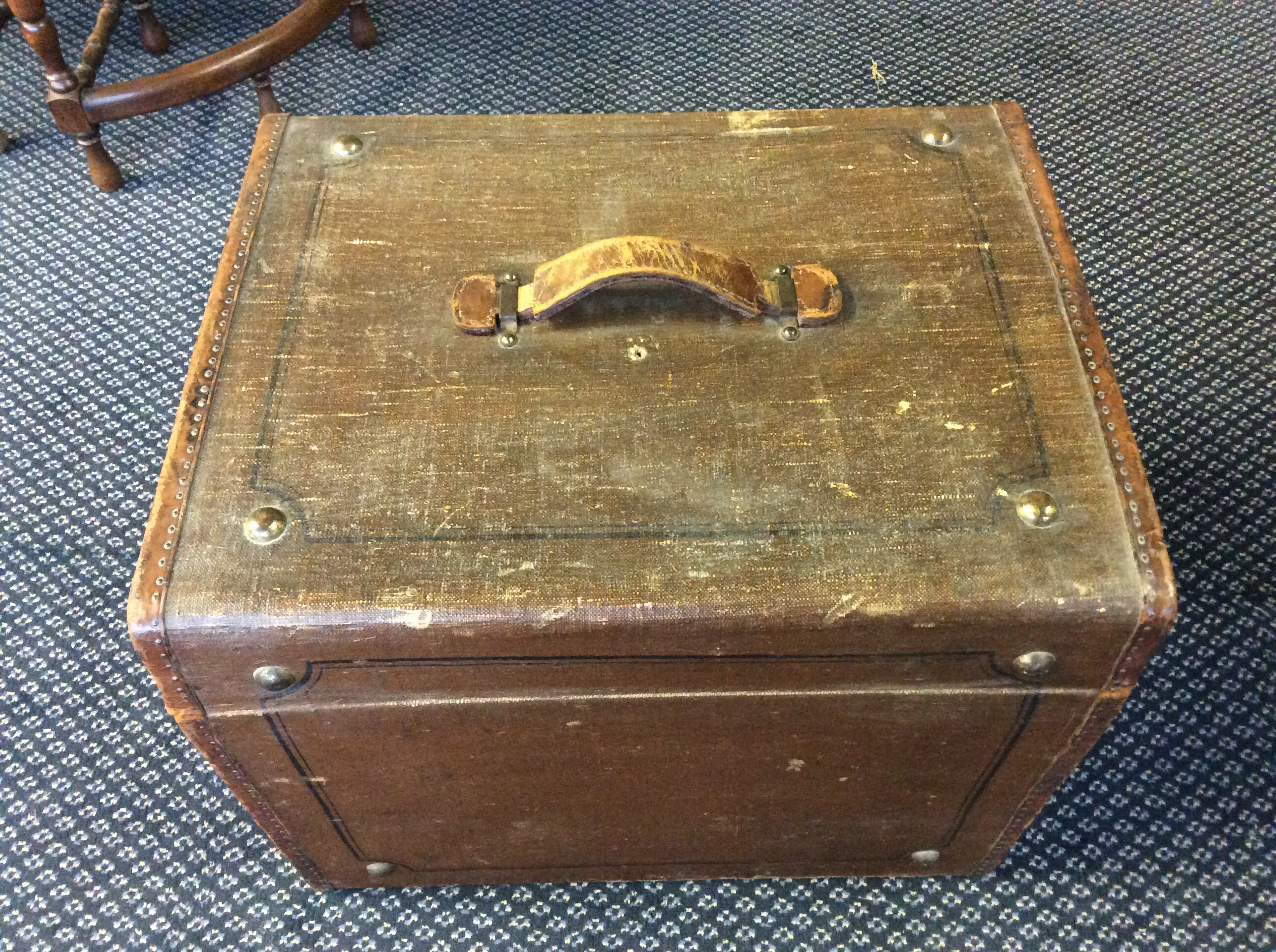 A brown travel trunk.