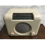 A cream baker lite Bush radio.