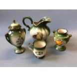A selection of green Mayfare Staffordshire pottery including five jugs, vases, mugs, etc.