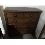 A mahogany three long and two short drawer chest.