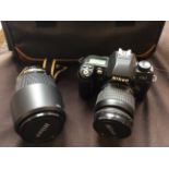 A Nikon AF Nikkor 28-80mm 1:3.3-5.6 G with 70-300mm 1:4-5.6 D lens, in case.
