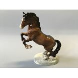 A Beswick rearing brown horse.