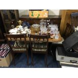 A mahogany dining table with four chairs and sideboard.