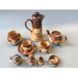 A selection of Doulton Lambeth salt glazed ware including jug, miniature tea pot, cup and saucer,