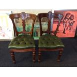 A set of four J.Reilly's late 19th century green leather upholstered chairs.