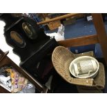 A black corner mirrored display cabinet, wicker chair and jug and basin set.