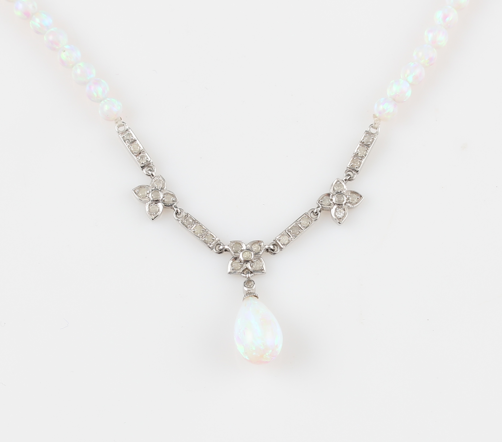 A synthetic opal and diamond necklet, featuring synthetic opal beads with diamond set flower