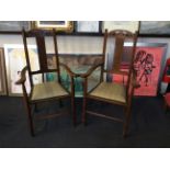 Two oak arts and craft style carver armchair.