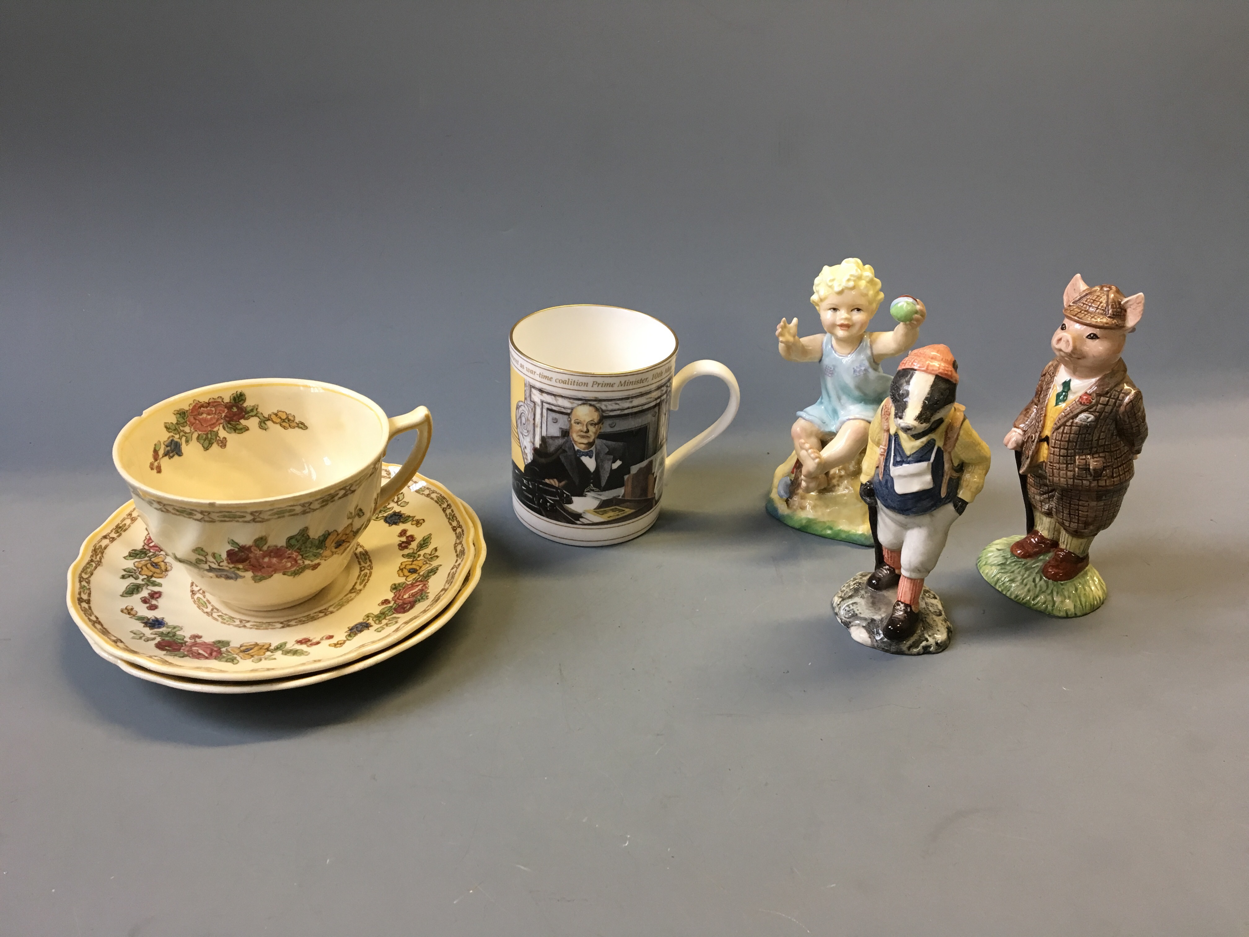 A Royal Doulton The Cavendish tea cup and two saucers with a Royal Worcester limited edition Winston