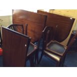 A reproduction mahogany twin pedestal table and six chairs.