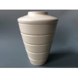 A Keith Murray Wedgwood cream vase. Height 29cm.