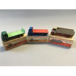A Dinky Supertoys No. 513 Guy flat truck with tailboard, No. 512 guy flat truck and No. 511 Guy 4-