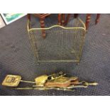 A brass fireside companion set with fire screen.