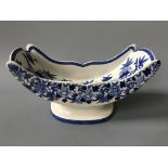 A Wedgwood blue and white cheese boat with floral design.