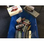 A box of Corgi buses and other vehicles.