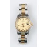 A 1970s Rolex Oyster Perpetual Date Chronometer bi-coloured wrist watch, the gold tone dial having