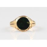 A Victorian 18ct yellow gold bloodstone signet ring, set with a circular piece of bloodstone,