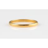 A wedding band, stamped 22ct, ring size R.