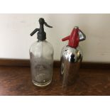 A chrome red topped soda dispenser together with a carved glass metal topped R. Whites mineral water