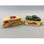 A Dinky 132 Packard convertible and 157 Jaguar XK120 coupe, in boxes. (NO CONDITION REPORT,