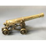 A pair of brass model canons.