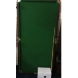 A 5ft collapsable snooker table with accessories.