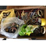 A box of costume jewellery to include bangles, necklets, beads, brooches etc.
