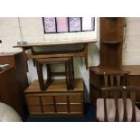 A teak nest of tables, coffee table, single drawer chest and corner cabinet.