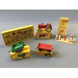 A Dinky 300 Massey Harris tractor, 341 Land-rover trailer, 429 trailer, 771 international road signs
